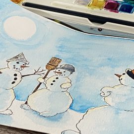 Foto einer Schneemann-Zeichnung vor dem Aquarellkasten