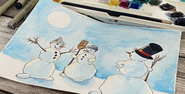 Foto einer Schneemann-Zeichnung vor dem Aquarellkasten