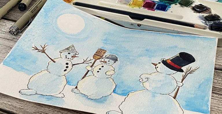 Foto einer Schneemann-Zeichnung vor dem Aquarellkasten